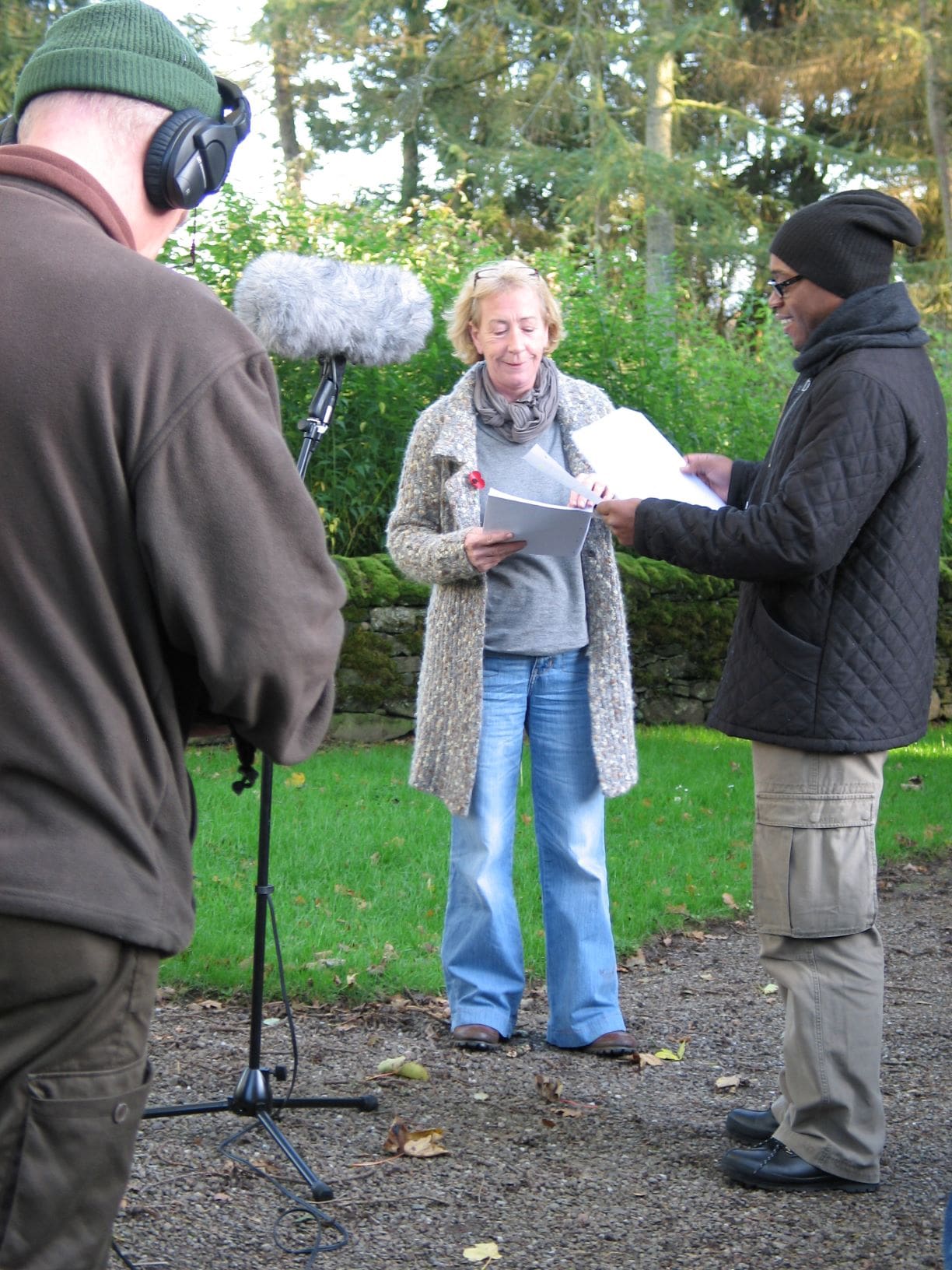 Actors prepare to record a scene from 'The Lamp'.