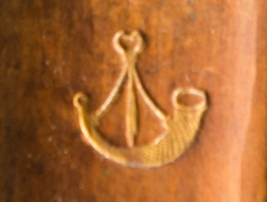 This hunting horn device was used by William Hunter and can still be seen on some of the spines of his books.
